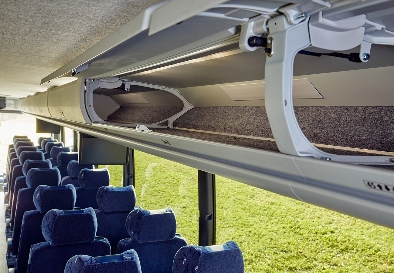 Passenger motorcoach charter bus overhead storage bin