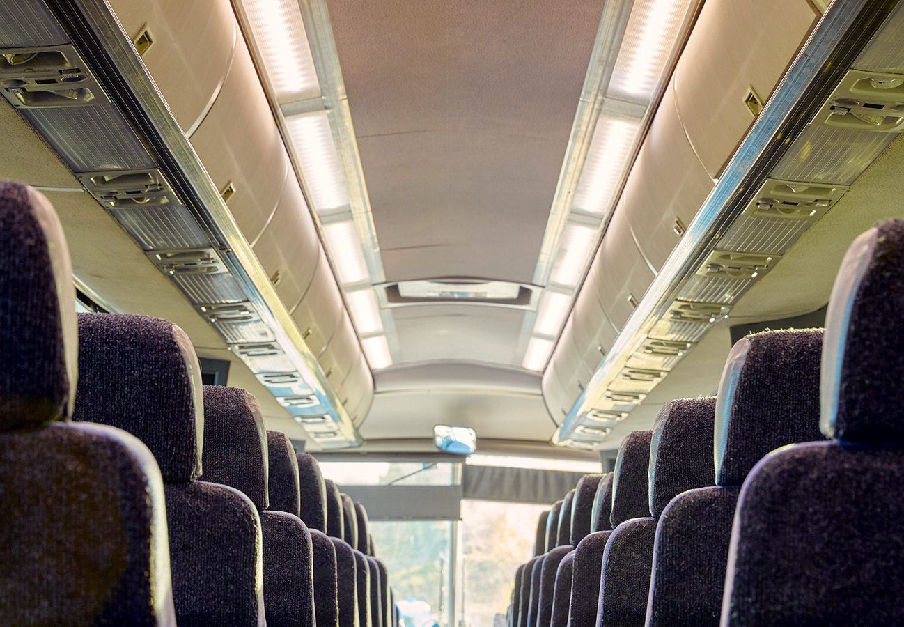 Passenger motorcoach charter bus seating aisle