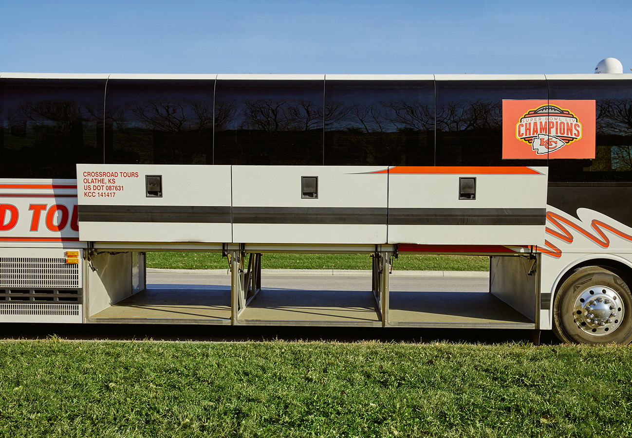 Passenger motorcoach charter bus with Kansas City Chiefs decal 