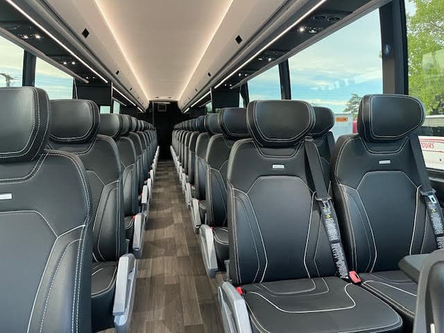 Prevost H3-45 interior aisle with reclining leather seats